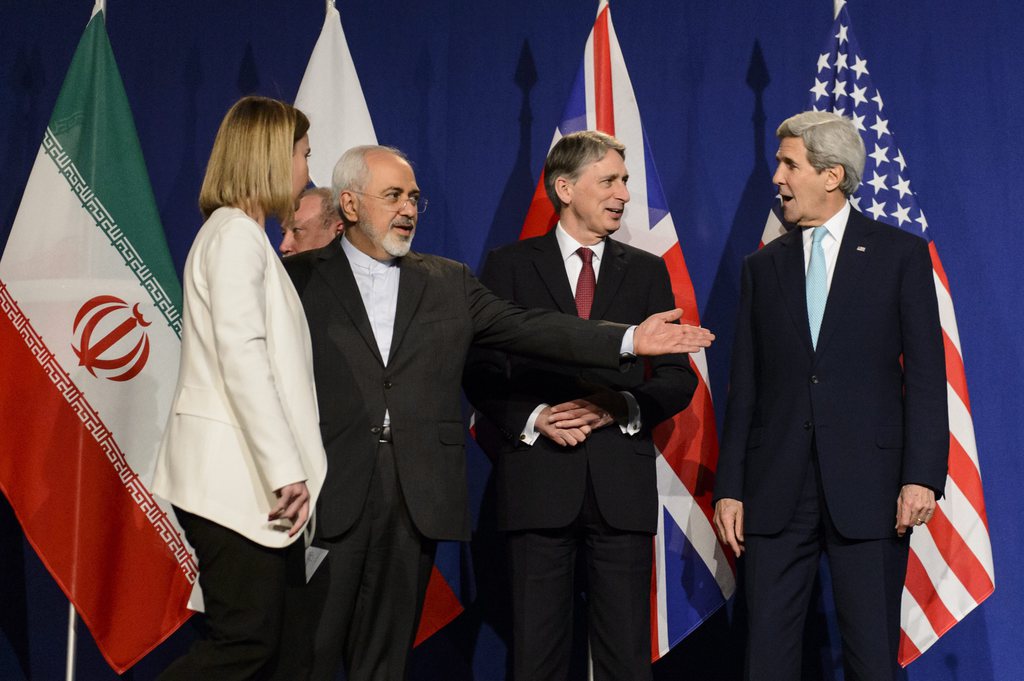 epa04690082 (L-R) EU High Representative for Foreign Affairs and Security Policy Federica Mogherini, Iranian Foreign Minister Mohammad Javad Zarif, British Foreign Secretary Philip Hammond, US Secretary of State John Kerry, reacts during a press event after the end of a new round of Nuclear Iran Talks in the Learning Center at the Swiss federal Institute of Technology (EPFL), in Lausanne, Switzerland, 02 April 2015.  EPA/JEAN-CHRISTOPHE BOTT