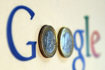 An illustration picture shows a Google logo with two one Euro coins, taken in Munich January 15, 2013.   REUTERS/Michael Dalder  (GERMANY - Tags: BUSINESS SCIENCE TECHNOLOGY) - RTR3CH3L