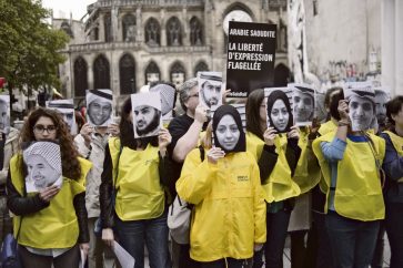 People demonstrate in support of Raif Badawi, who was sentenced to 1,000 lashes for "insulting Islam, on May 7, 2015 in Paris. The case of Badawi, 31, has sparked worldwide outrage and criticism from the United Nations, United States, the European Union, Canada and others.  Badawi co-founded with Suad al-Shammari the Saudi Liberal Network Internet discussion group. He was arrested in June 2012 under cybercrime provisions, and a judge ordered the website shut after it criticised Saudi Arabia's notorious religious police. Badawi was initially sentenced to seven years in jail and 600 lashes for insulting Islam and setting up the liberal network. AFP PHOTO / STEPHANE DE SAKUTIN