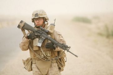 U.S. Marine Lance Cpl. Johnathan Bruch with 2nd Platoon, Alpha Company, 1st Battalion, 7th Marine Regiment, patrols down a street near Saqlawiyah, Iraq, May 31. U.S. Marines with A Co, 1/7 were conducting a local security patrol around Combat Outpost Viking.