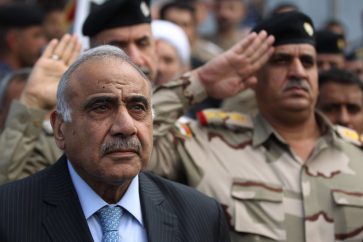 (FILES) In this file photo taken on October 23, 2019 Iraq's Prime Minister Adel Abdel Mahdi speaks during a funeral ceremony in Baghdad. - Iraq's embattled premier announced yesterday he would resign in keeping with the wishes of the country's top cleric, as renewed violence added to a soaring death toll in two months of anti-government protests. (Photo by AHMAD AL-RUBAYE / AFP)