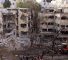 Des secouristes se tiennent au milieu des décombres d'un immeuble endommagé à Tel-Aviv, suite à une attaque de missiles iraniens le 16 juin 2025. ©AFP
