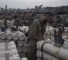 Des soldats israéliens stockent des obus de char près de la frontière avec Gaza. ©AP